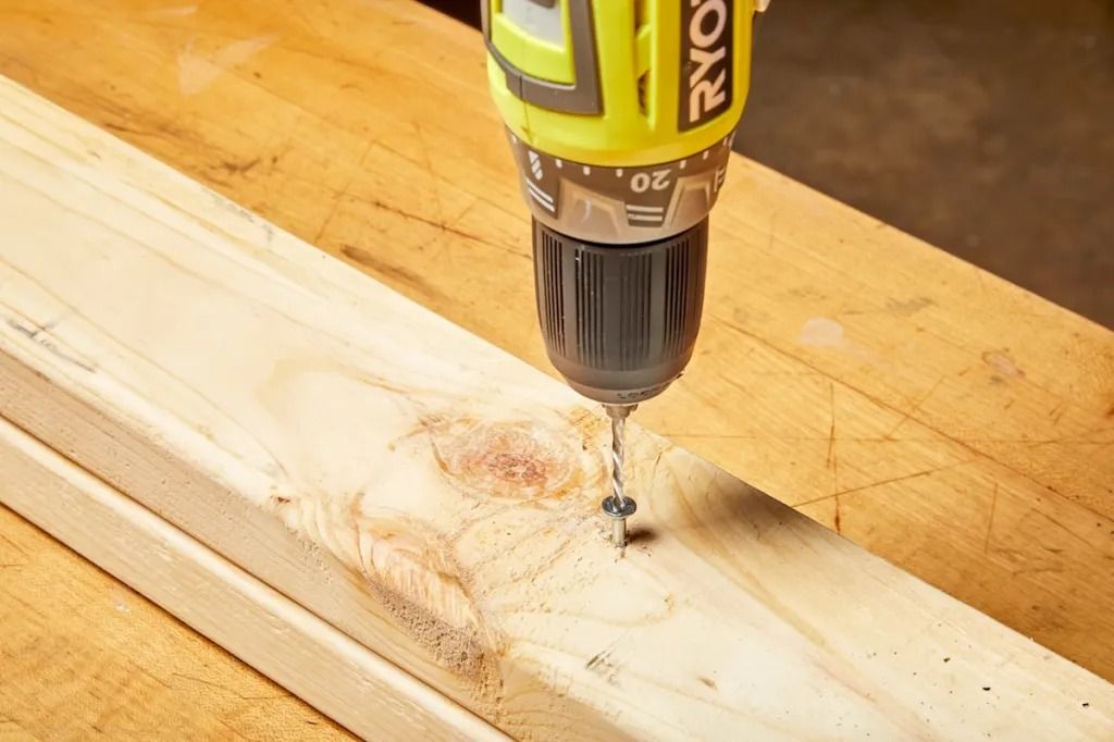 Left-handed drill bit removing a screw