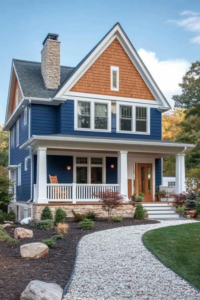 An image of Elegant dark blue house with cedar accents and bright white trim.
