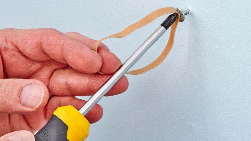 Rubber band screw removal method