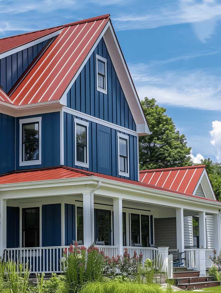 An image of Dark blue house with cedar roof and crisp white trim.