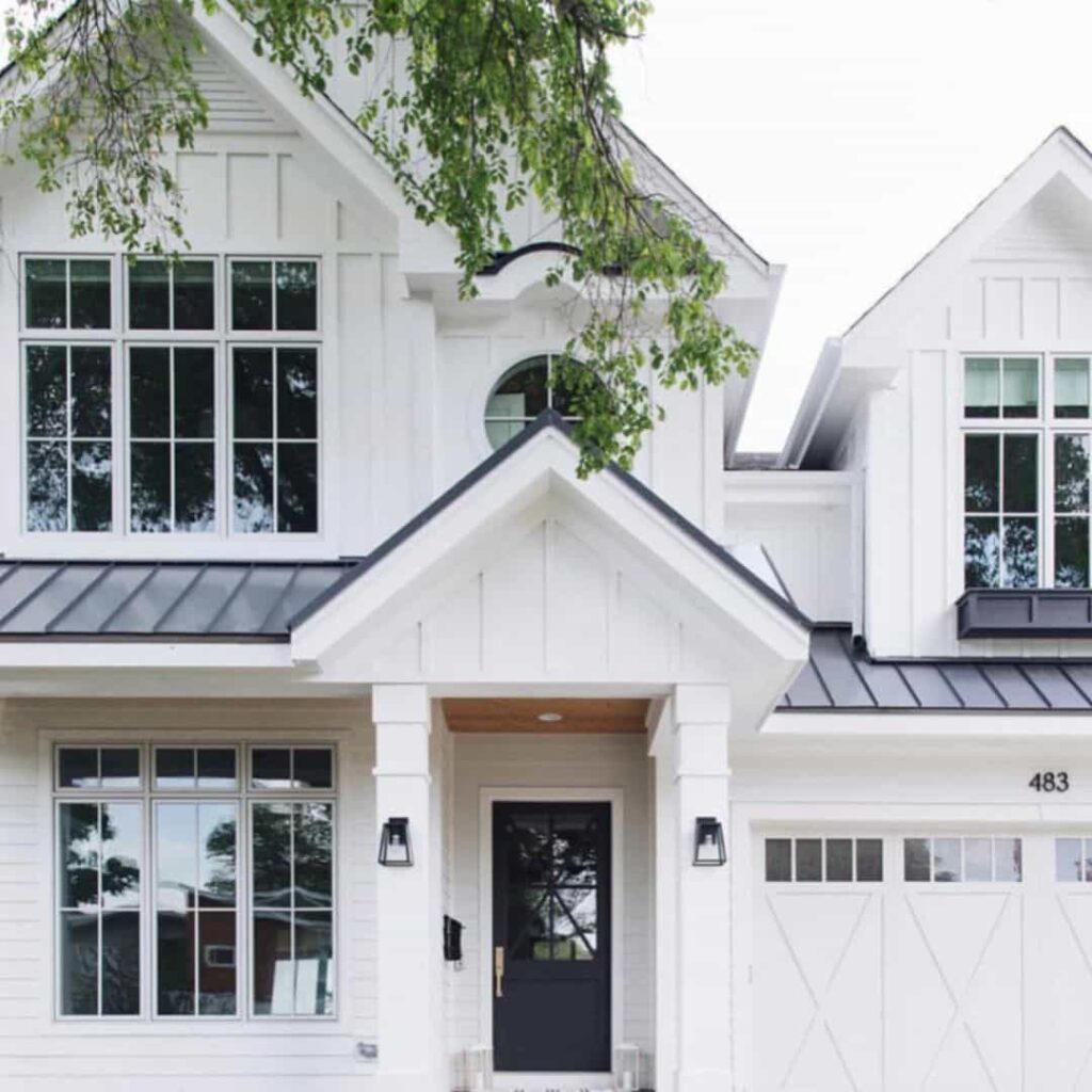 An image of a Metal black window with white grids and trim.